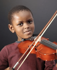 Child learning the violin